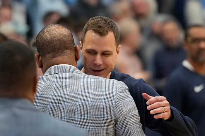 Duke basketball head coach Jon Scheyer versus UNC